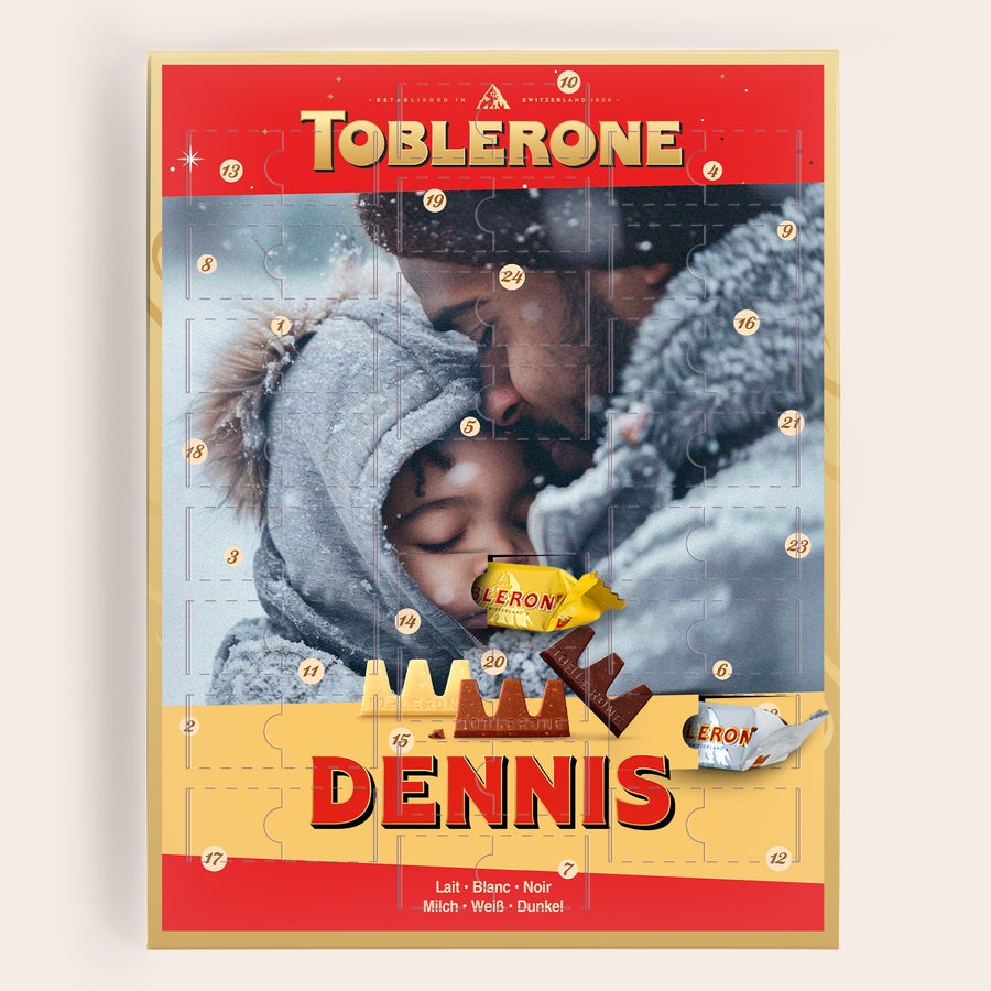 Toblerone adventskalender 2025 Gepersonaliseerde Toblerone adventskalender bedrukt met foto van een vader en kind in de sneeuw en de naam Dennis
