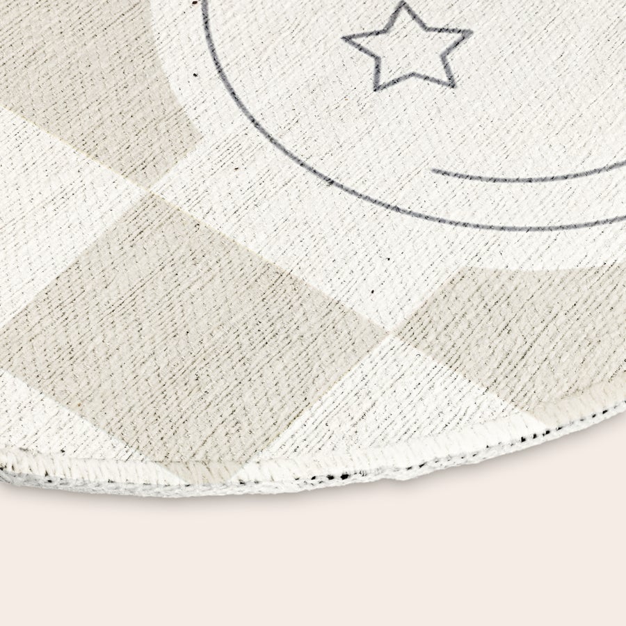 Personalised play mat - ø 152 cm Close up of a personalized play mat with a partial star and circular design, showing its texture.
