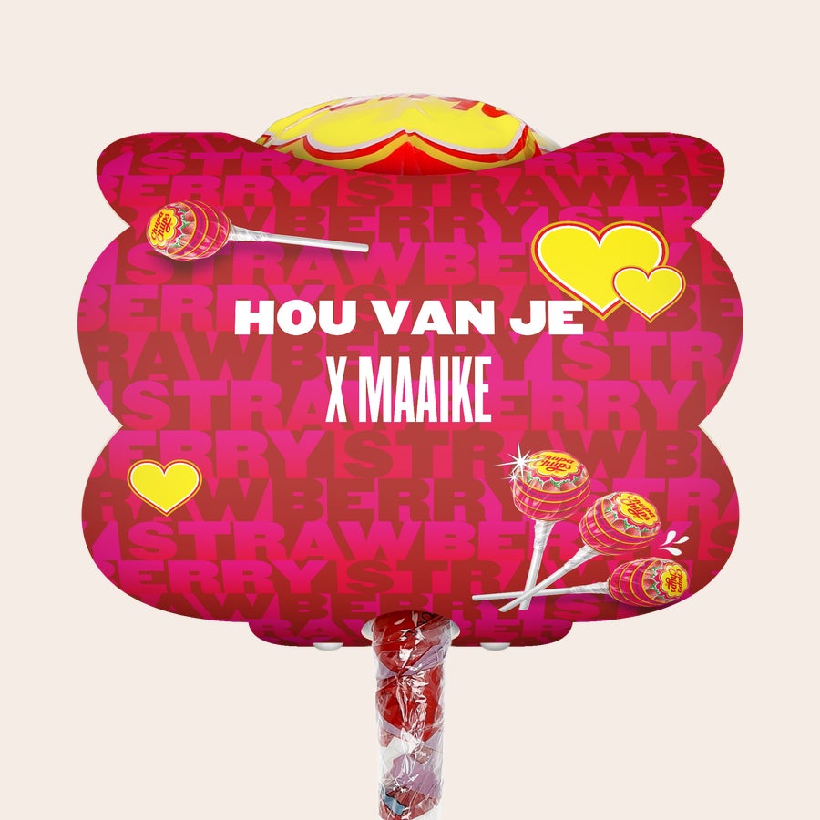 Mega Chupa Chups personaliseren Gepersonaliseerde Mega Chupa Chups lolly met aardbei smaak, bedrukt met de tekst HOU VAN JE X MAAIKE en twee gele hartjes. Dit cadeau bevat 20 lollys.