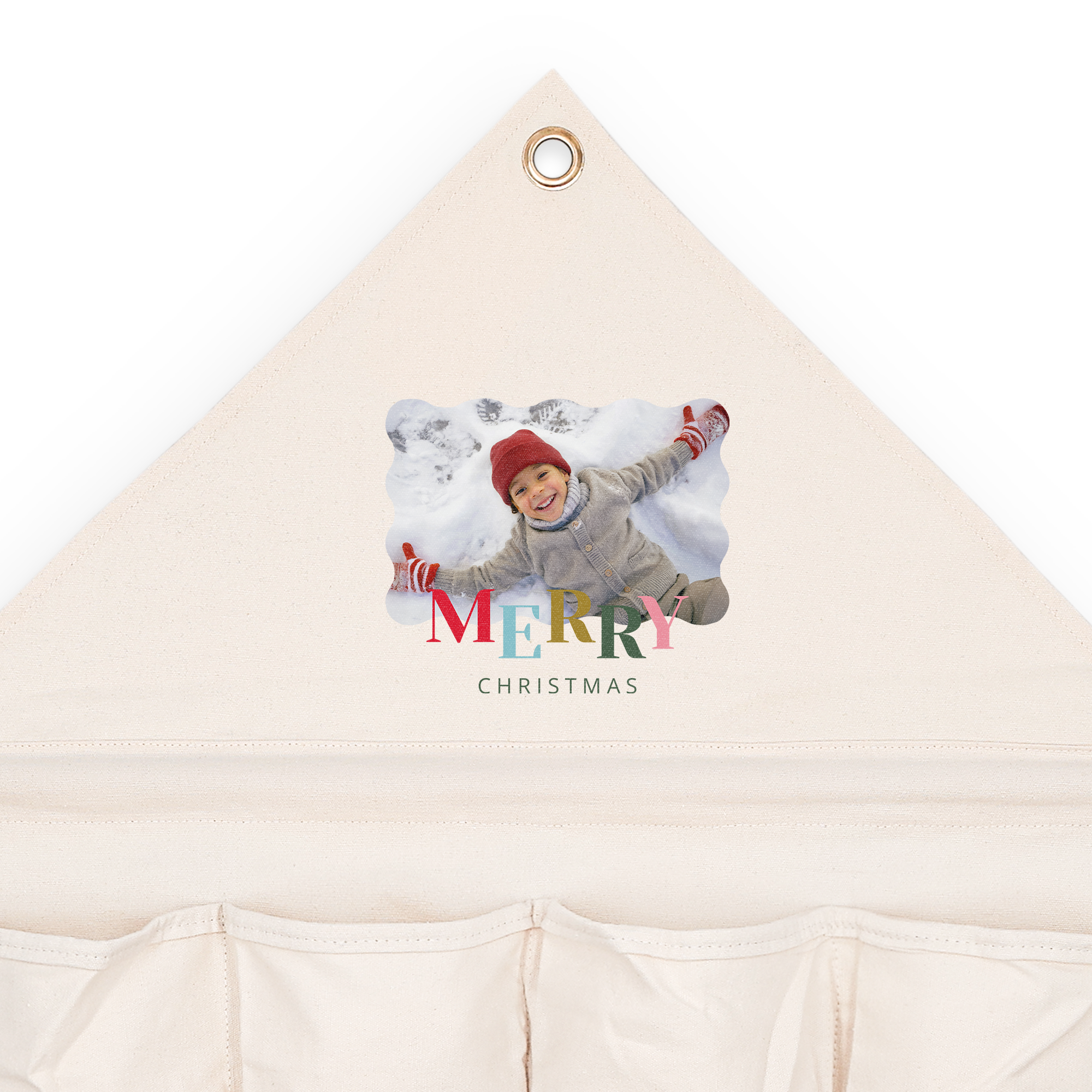 Personaliziran adventni koledar iz blaga z natisnjeno fotografijo otroka v snegu in napisom "MERRY CHRISTMAS", kot nalašč za odštevanje do božiča.