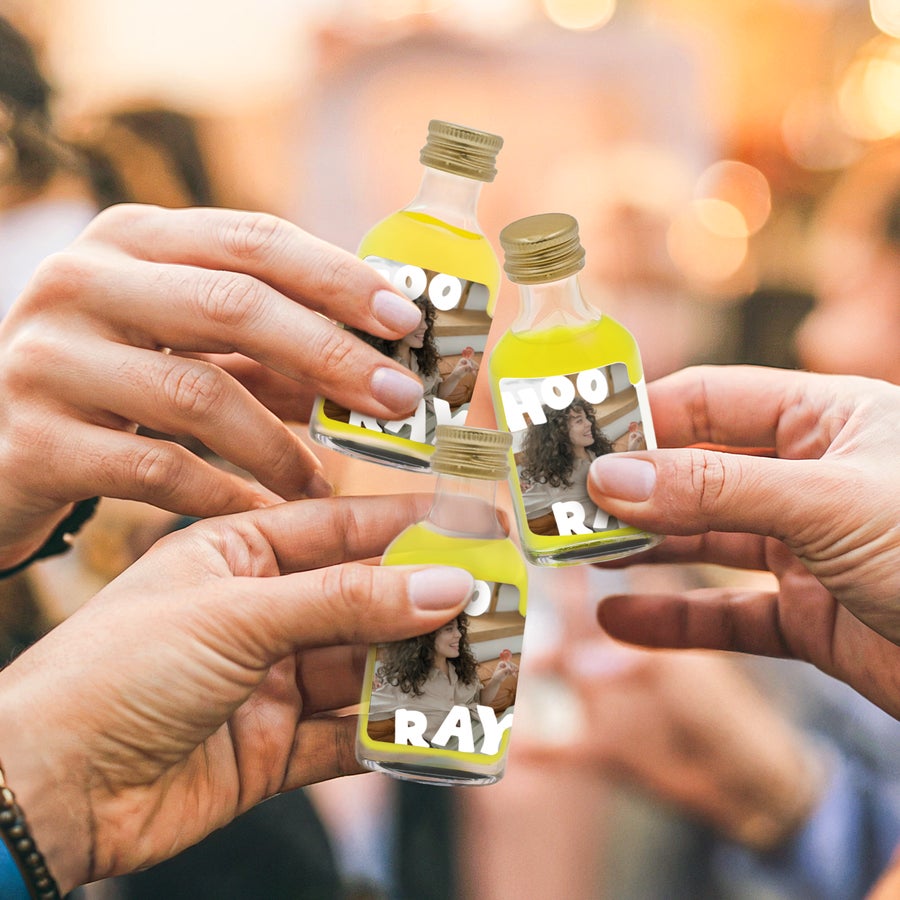 Personalised Mini Limoncello - 10 pcs Hands toasting a unique Mini Limoncello collection with personalized photo labels and white text HOORAY