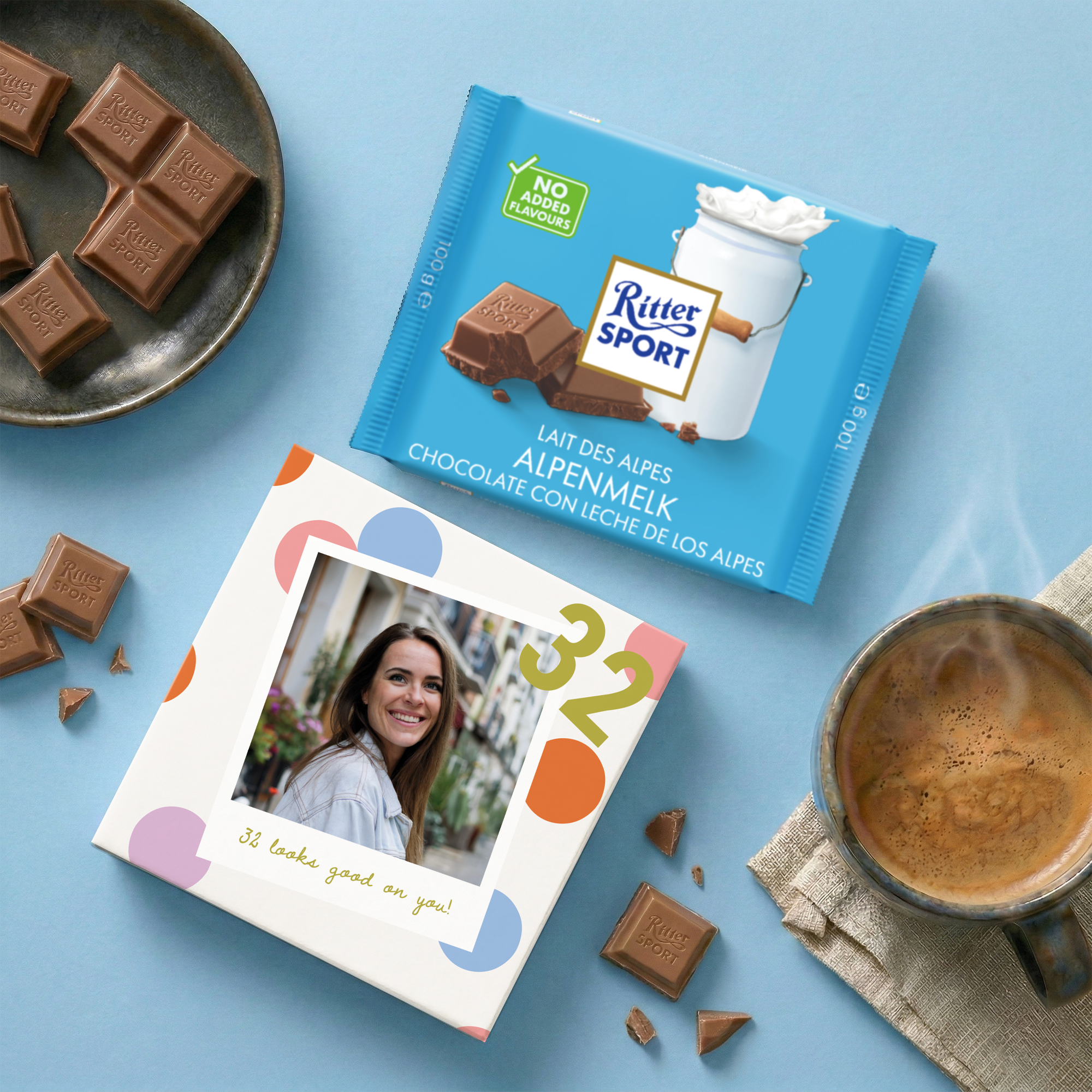 Personalised chocolate - Ritter Sport - Alpine Milk custom printed with a photo and text alongside the candy bar and a cup of coffee