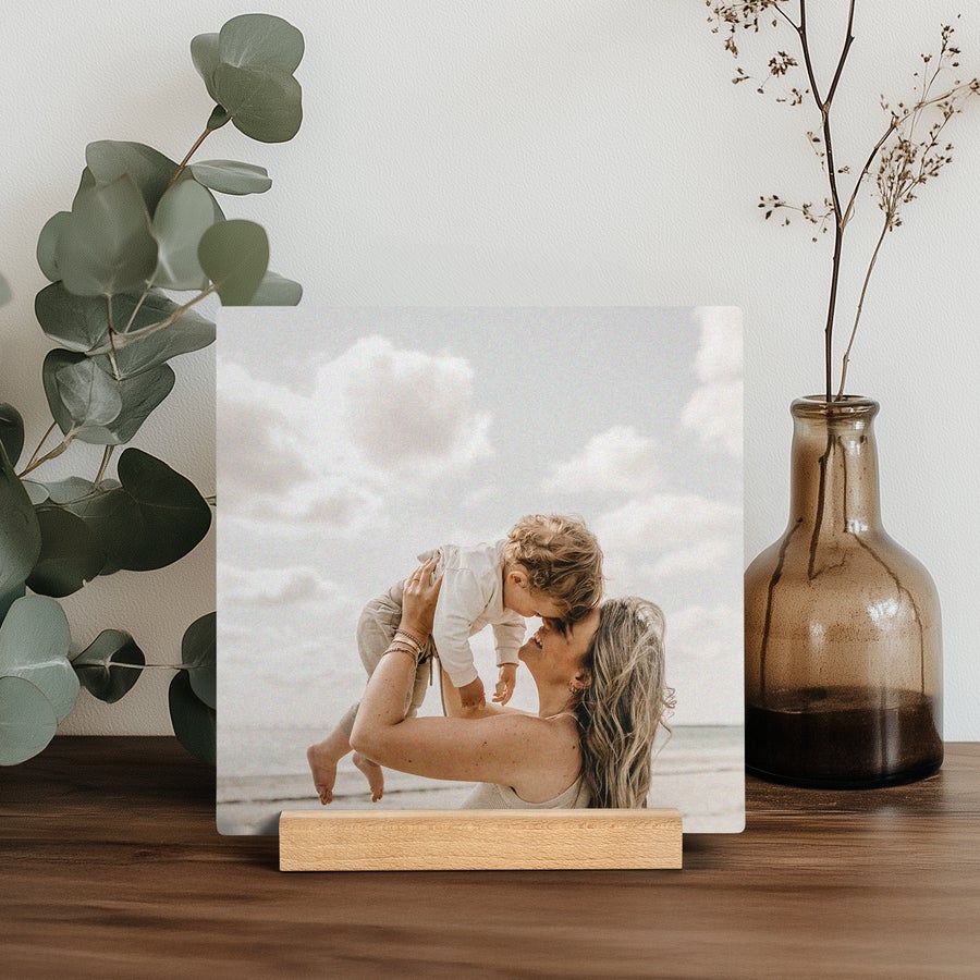 Wooden Photo Tile A square Forex Photo Tile printed with a personalized photo of a mother and child, presented on a wooden stand.