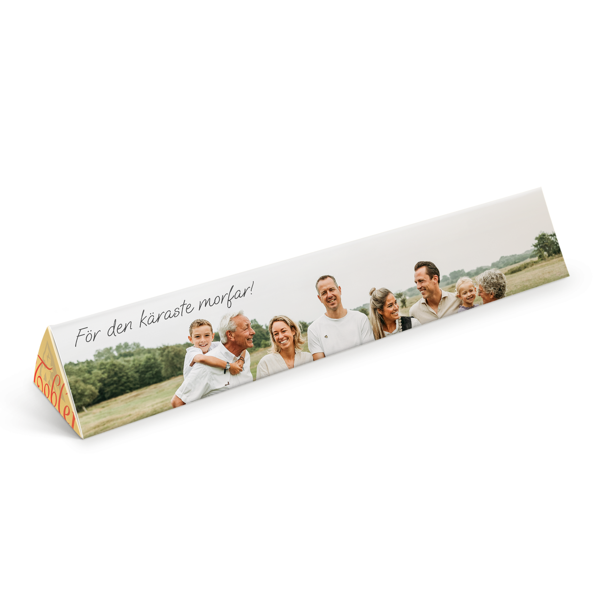 En personaliserad Toblerone med ett foto av en familj tryckt på förpackningen och texten "För den käraste morfar!"