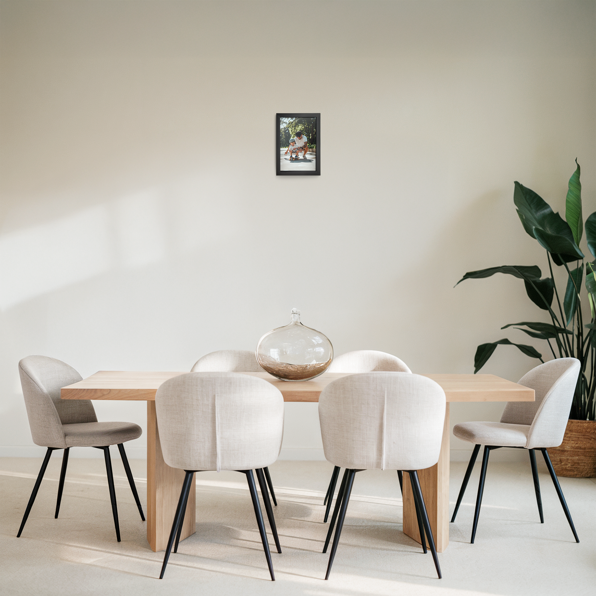 Personalized photo print with a black frame on a light wall