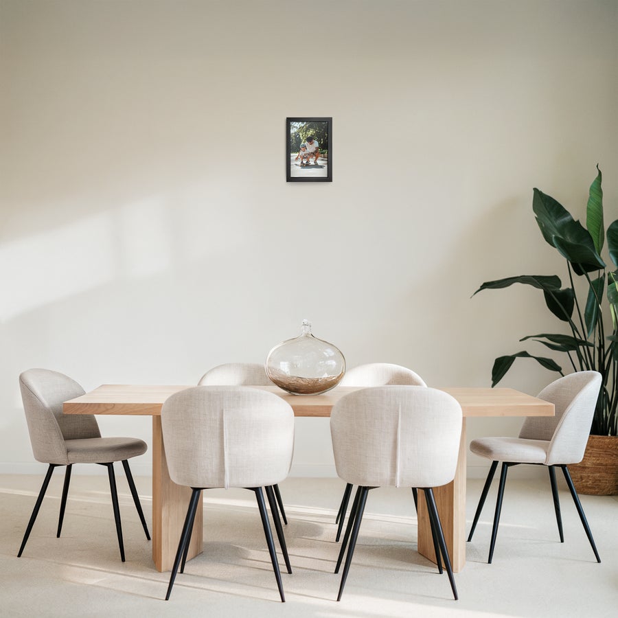Personalised photo print with frame Personalized photo print with a black frame on a light wall