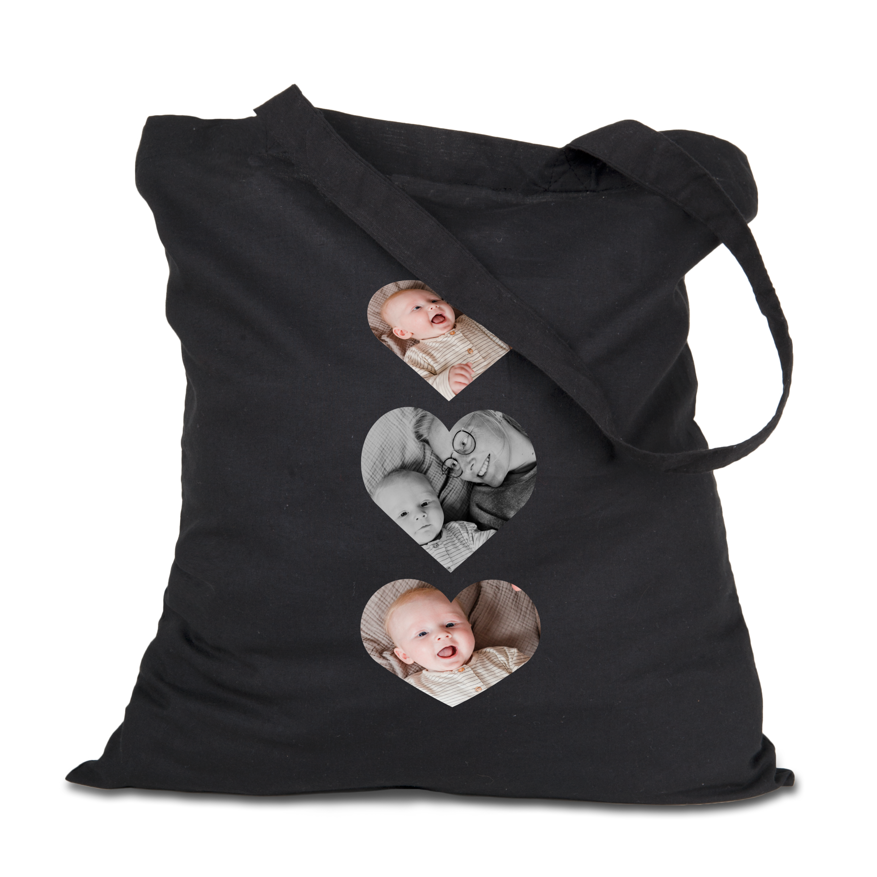 Zwarte linnen tas bedrukt met drie hartvormige babyfoto's onder elkaar om je favoriete spullen mee te nemen