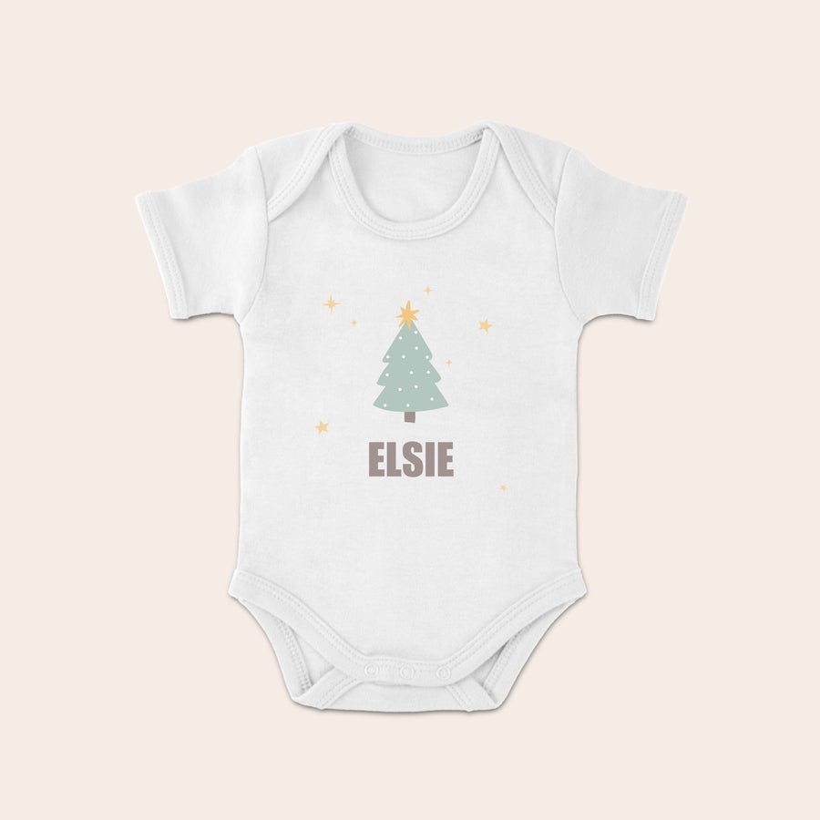 Baby's first Christmas Babygrow White short-sleeved Christmas babygrow with a printed Christmas tree design and the name Elsie