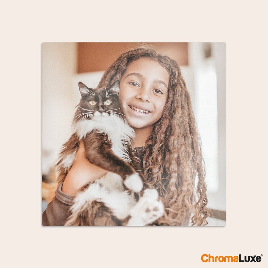Aluminium photo panel Chromaluxe aluminium photo print of a smiling girl holding a black and white cat, personalized with a cherished photo