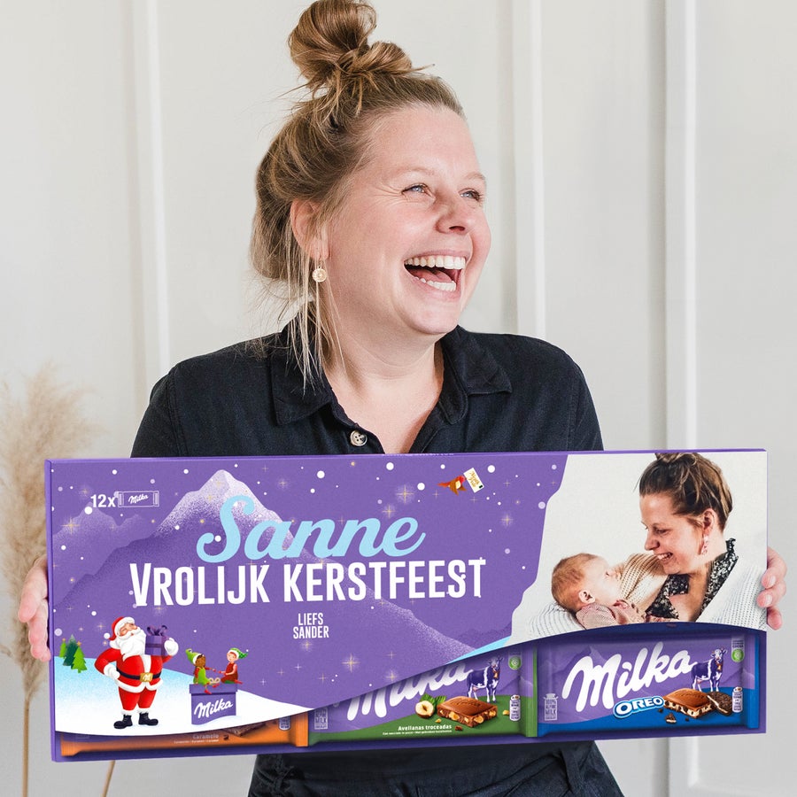 Mega Milka reep met naam en foto bedrukken Mega Milka reep met naam en foto bedrukken - 12 repen, gepersonaliseerd met een foto, de naam Sanne en de boodschap Vrolijk Kerstfeest.