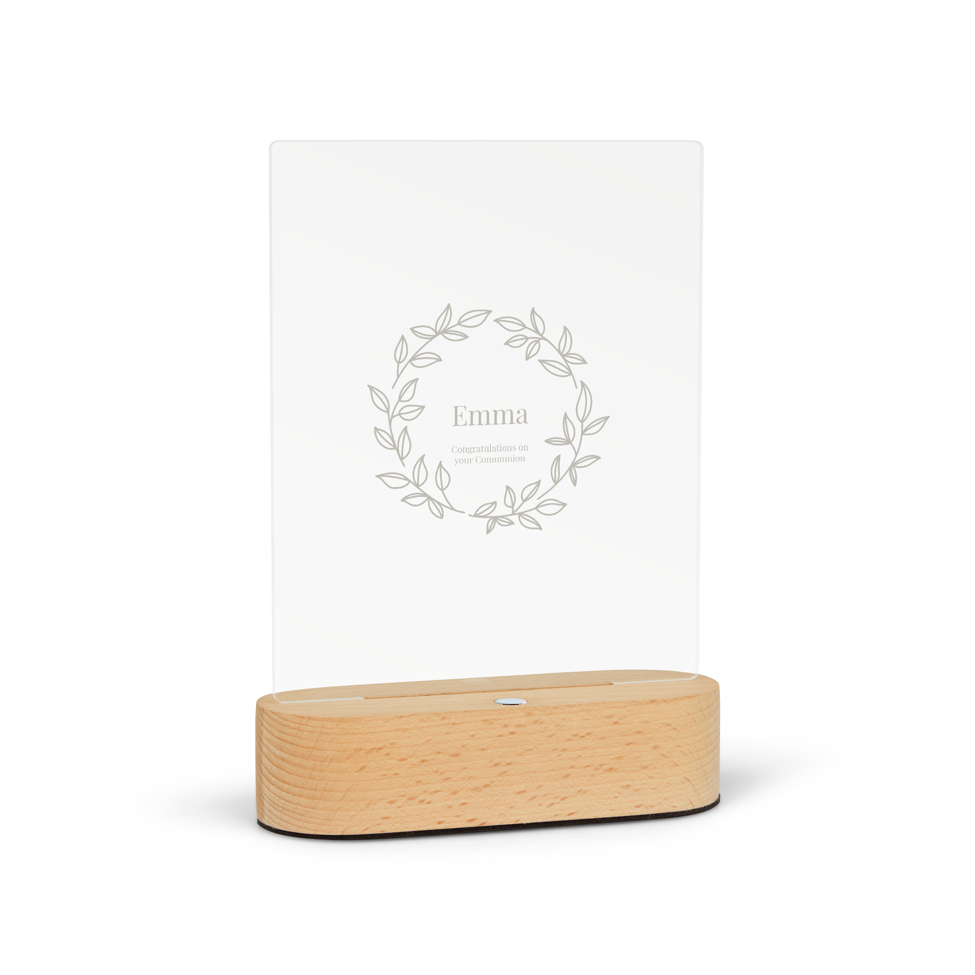 Engraved light with the name Emma and the message Congratulations on your Communion, surrounded by a laurel wreath design