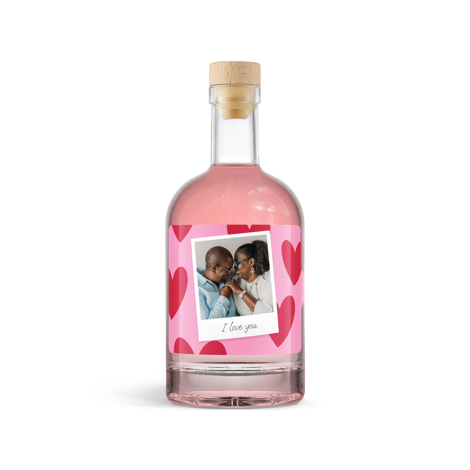 Fles pink gin met roze etiket vol rode hartjes, gepersonaliseerd met een foto van een koppel en de tekst 'I love you'
