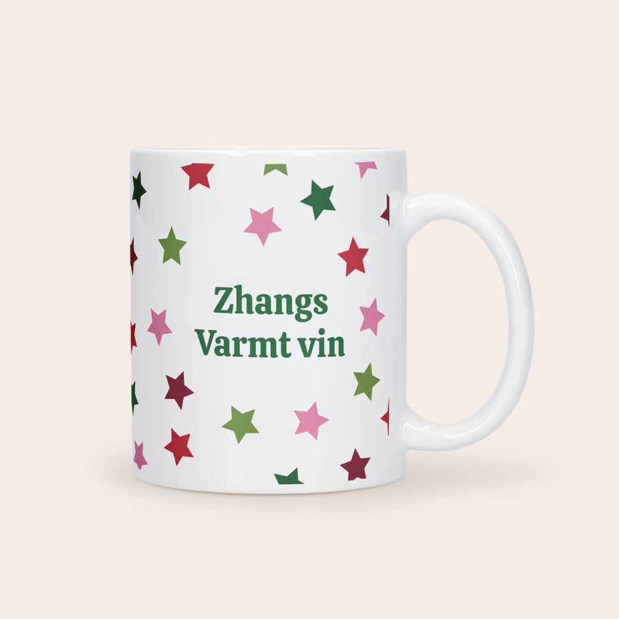 Julmugg med Foto Vit julmugg med julstjärnor i rött, rosa och grönt och tryckt med egen text Njut av julstämningen med din egna julmugg
