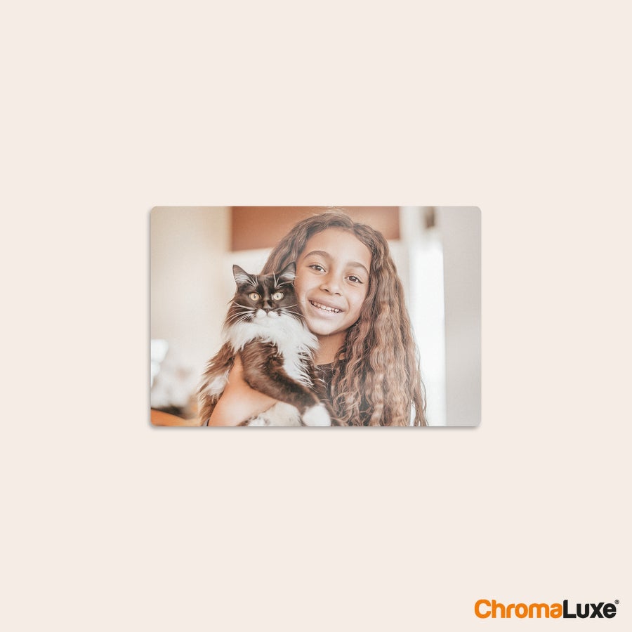 Aluminium photo panel Chromaluxe aluminium photo print of a girl holding a black and white cat, personalized with a cherished memory