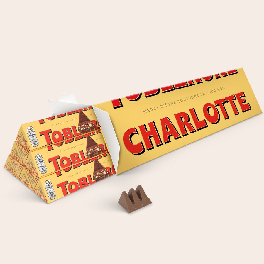 Toblerone personnalisé Toblerone personnalisé - 1800 g avec nom Charlotte imprimé sur emballage jaune et message personnalisé.
