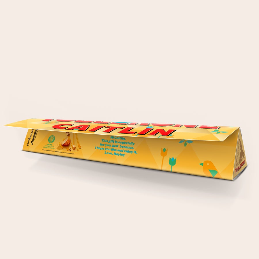 Personalizowana czekolada Toblerone - Wielkanoc Spersonalizowana czekolada Wielkanocna Toblerone z nadrukowanym imieniem Caitlin i wiadomością