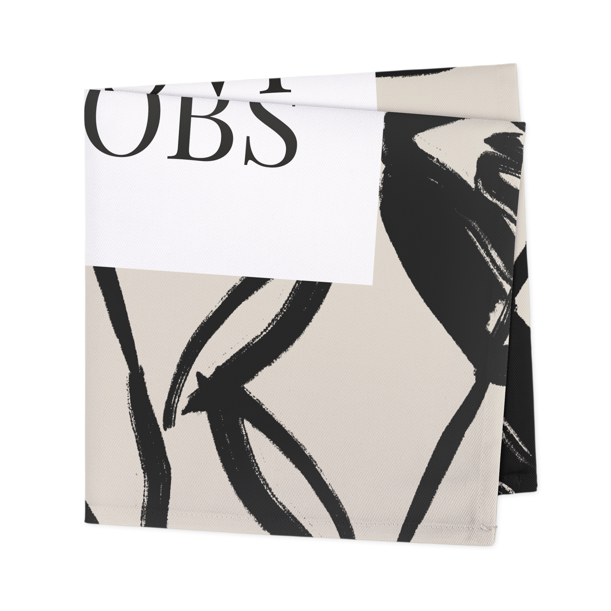 Bedrukte servetten met wit label en zwarte letters U en B, verder zwarte abstracte vormen.