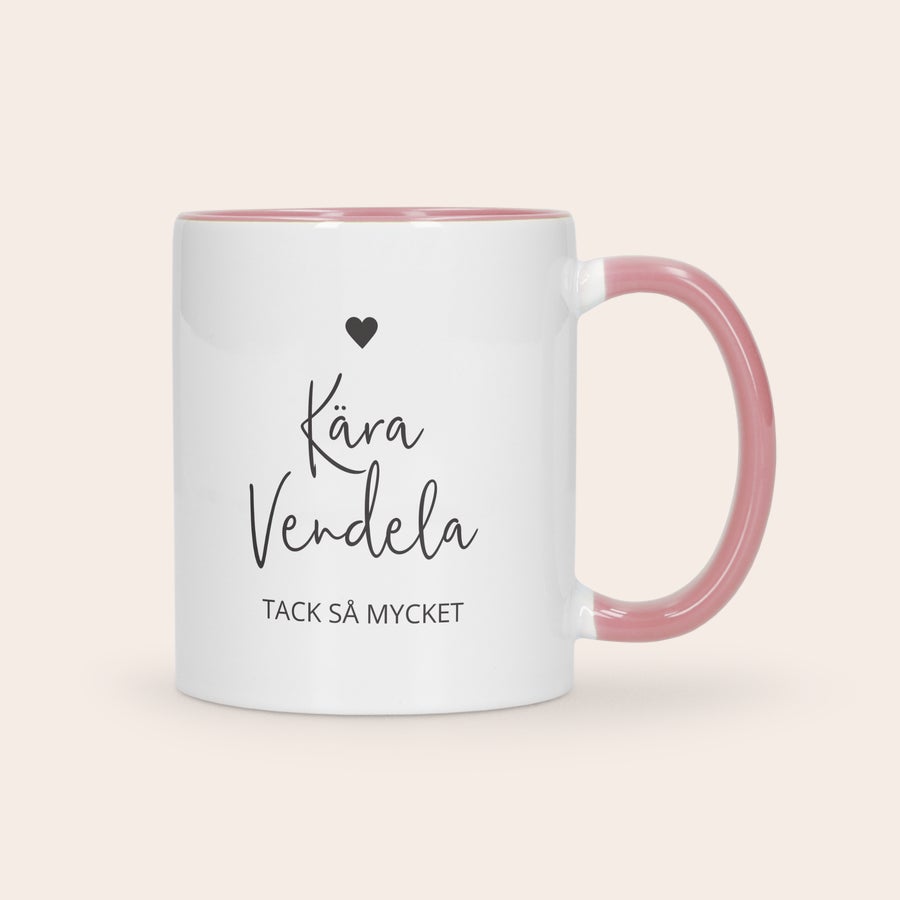 Färgade muggar Vit mugg med rosa insida och handtag, tryckt med en svart text Kära Vendela Tack så mycket. Ge en färgglad mugg som en gåva!