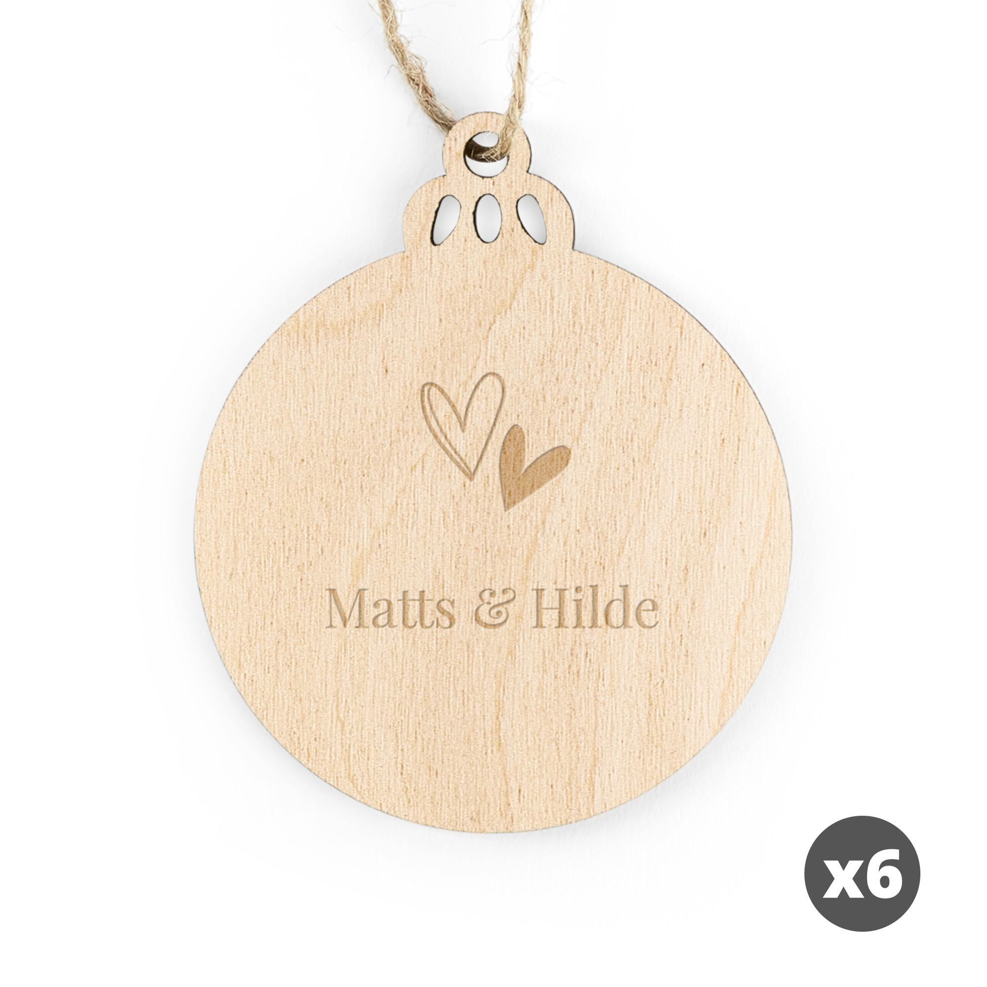 Gravert julestjernedekorasjon i tre