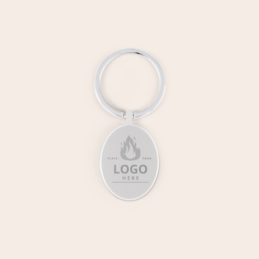 Breloc cu Breloc oval personalizabil, metalic argintiu, gravat cu fotografia sau logo-ul dorit.
