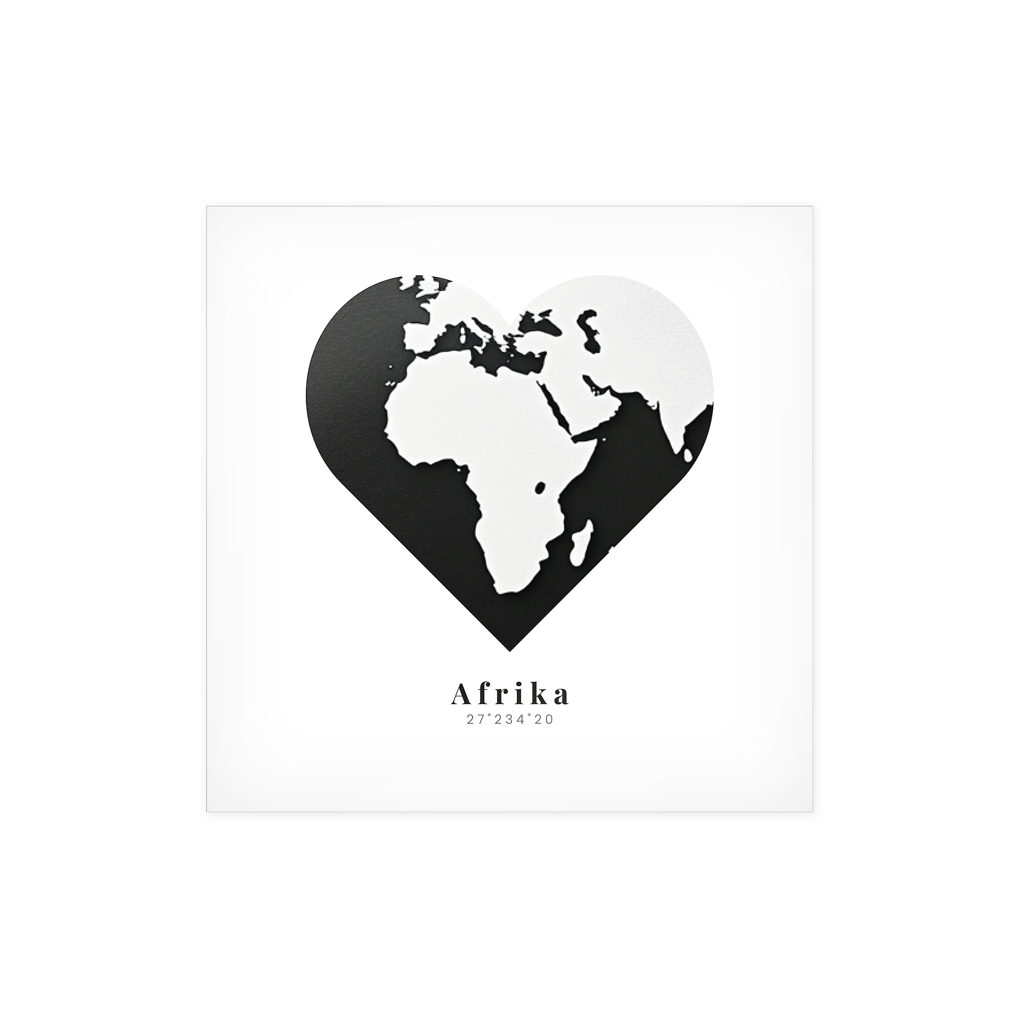 Black and white framed poster photo print featuring the continent of Africa within a heart shape and text reading Afrika 27°23'4"20