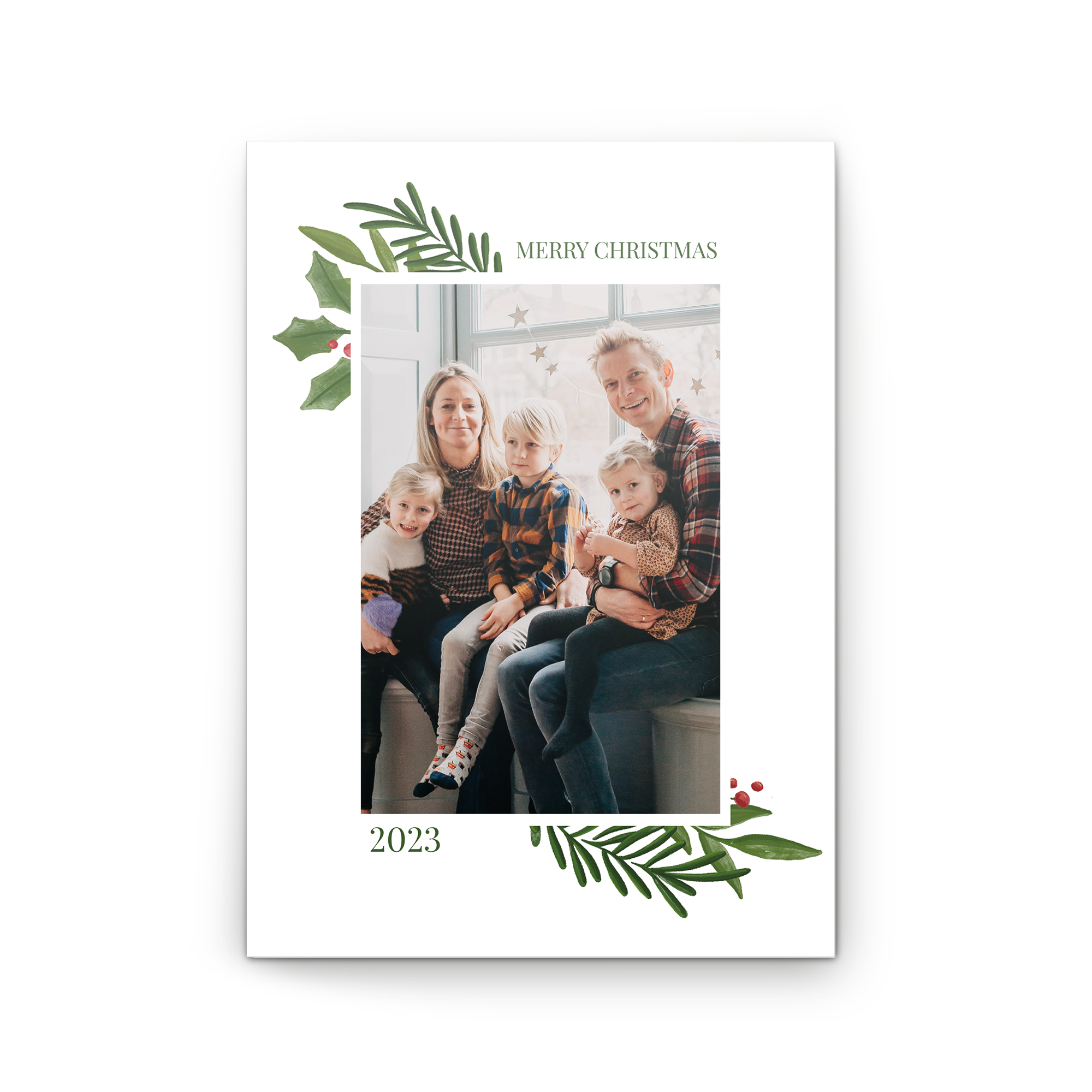 Personalised greeting card with a family photo and Merry Christmas text framed by green leaves