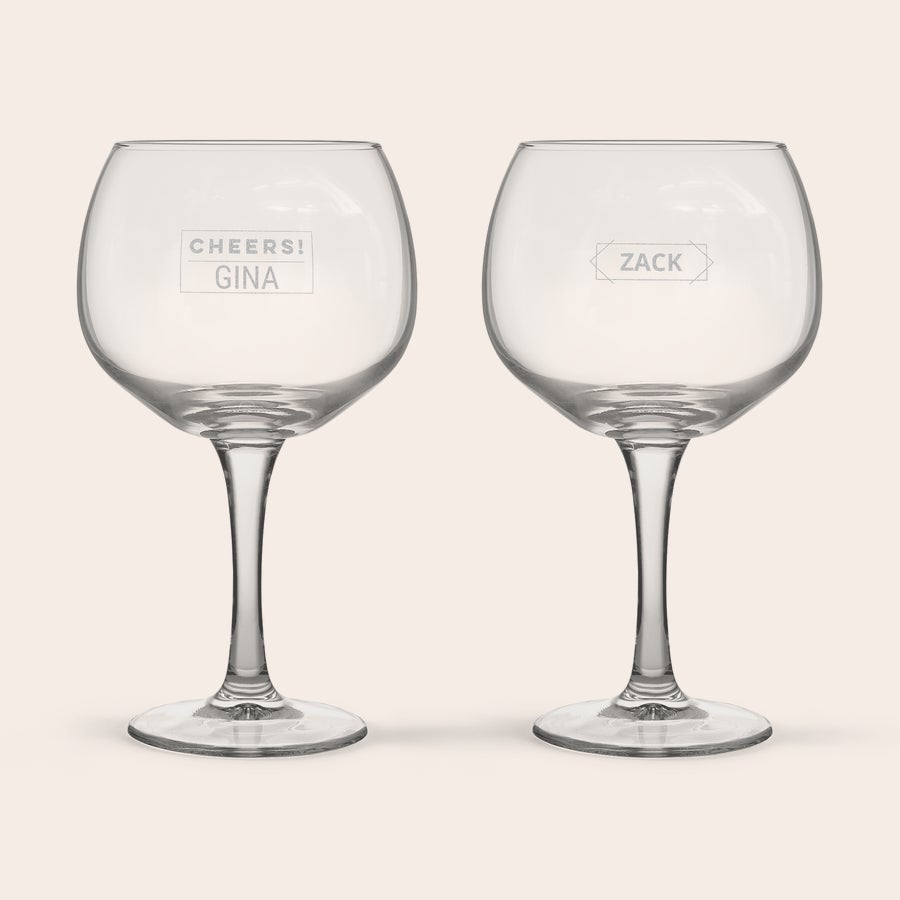 Personalised Gin & Tonic Glasses Two personalized gin and tonic glasses, one engraved with Cheers Gina and the other with Zack