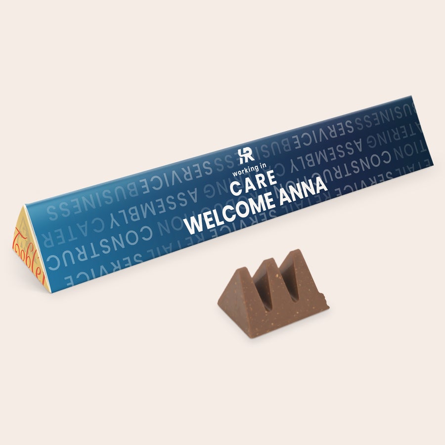 Personalised Toblerone XXL Chocolate Bar Giant Toblerone milk chocolate bar with a blue wrapper printed with the text "WELCOME ANNA" is a truly BIG surprise