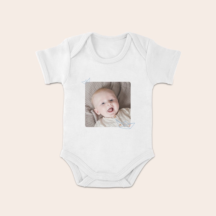 Personalised baby grow White babygrow printed with a happy baby photo, a cute printed babygrow for new parents.