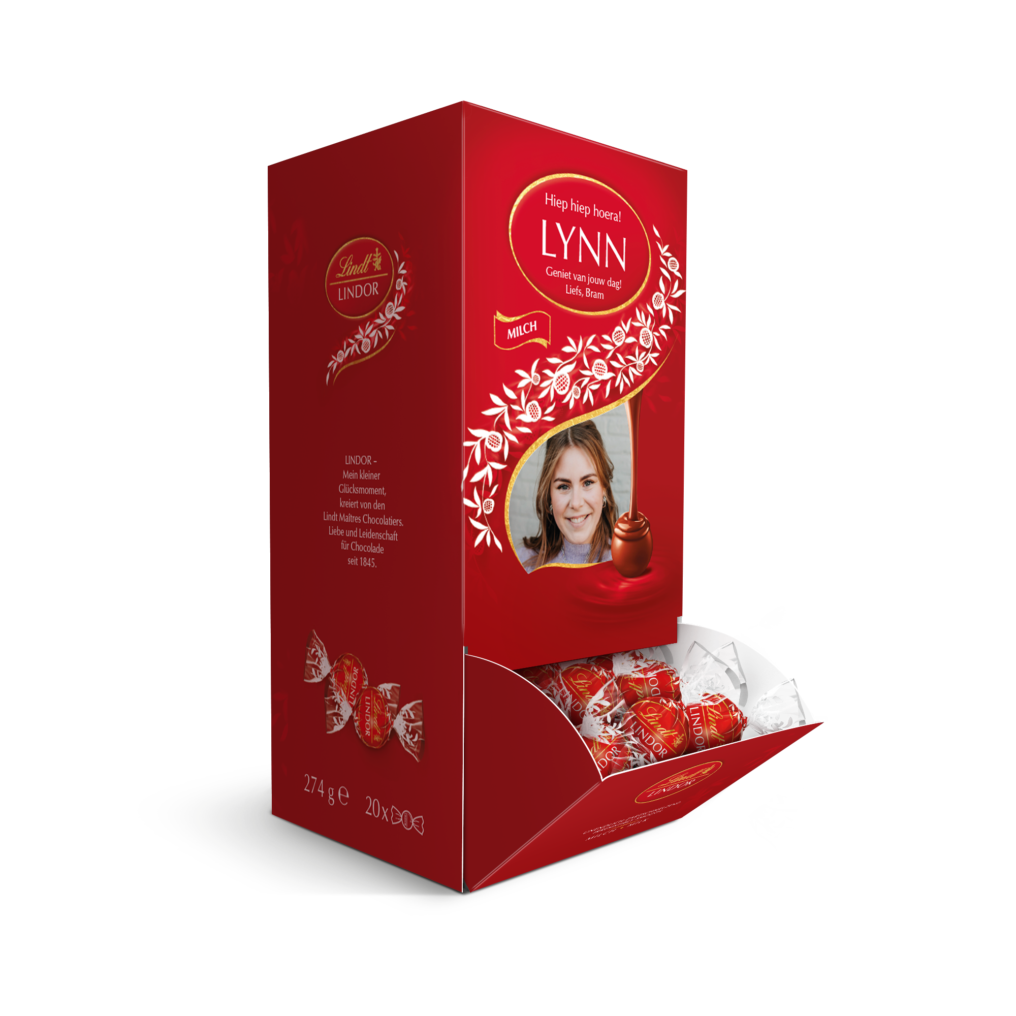 Rode Lindt Milk Dispenser bedrukt met foto en naam Lynn, gevuld met Lindor melkchocolaatjes.