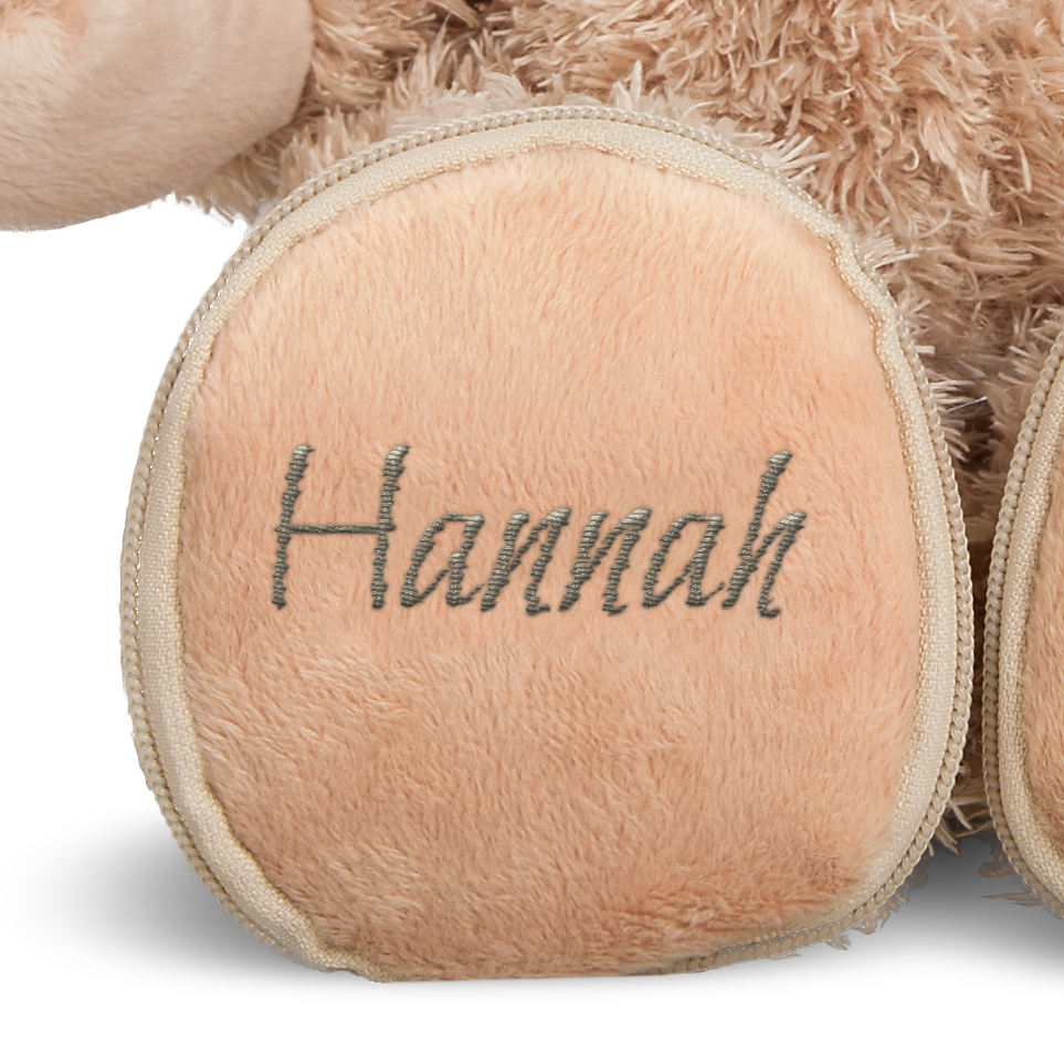 Personalisierter Teddybär mit dem Namen Hannah in Grau auf einer Tatze gestickt
