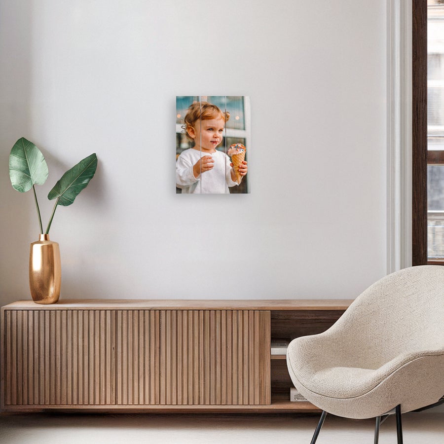 Photo on wood Custom photo print on wooden planks of a toddler with an ice cream cone