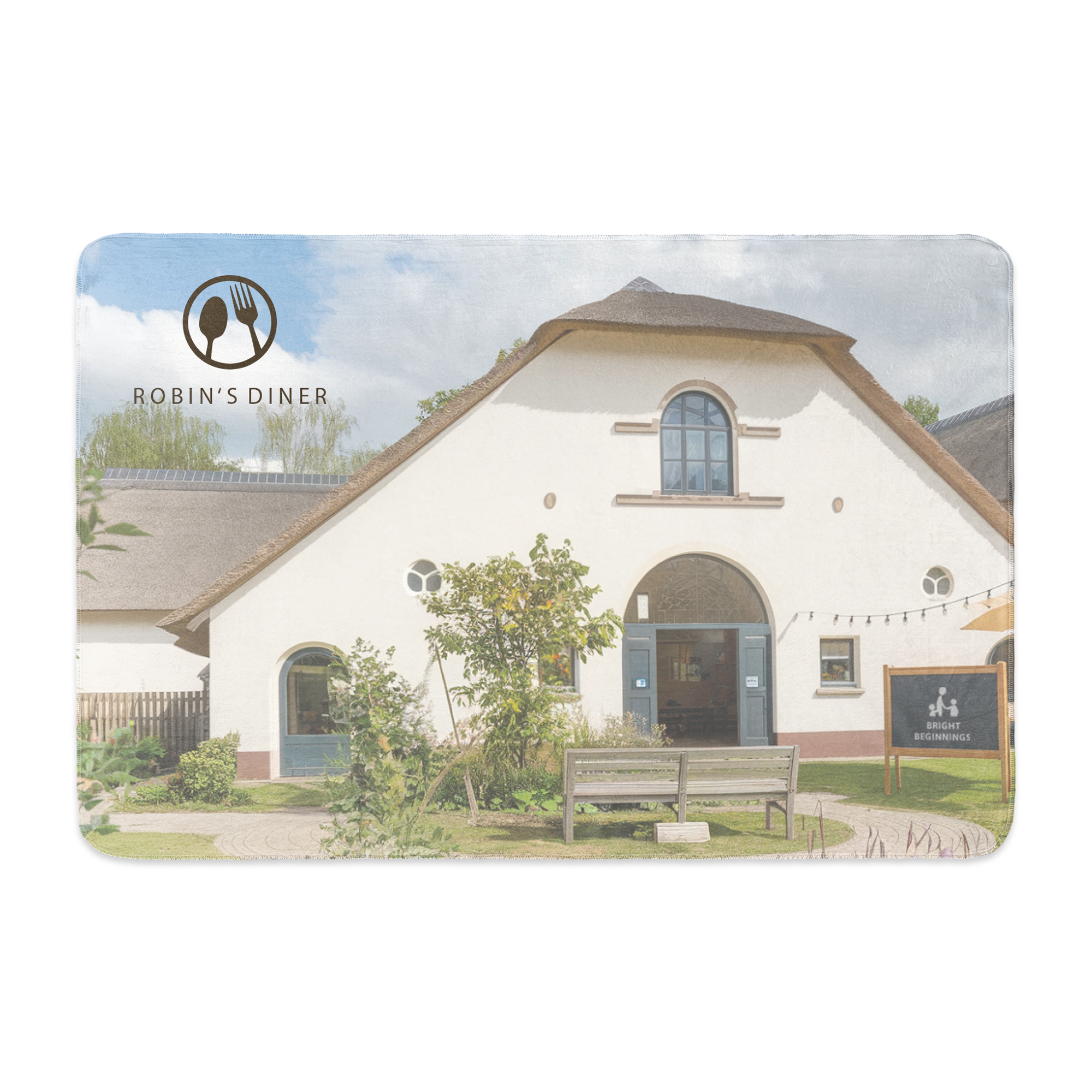 Personalized fleece blanket printed with a photo of a restaurant called Robin's Diner, with a thatched roof.