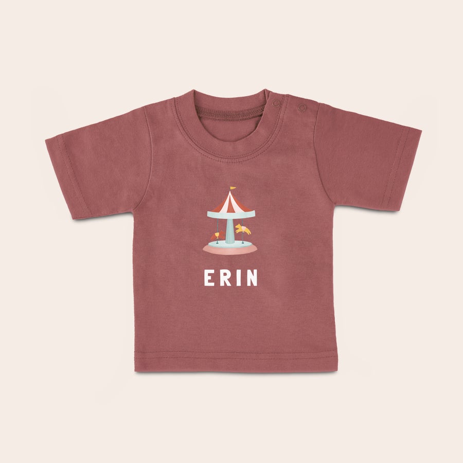 Personalised baby t shirt Pink baby shirt printed with a carousel design and personalized with the name Erin, perfect for your little one.
