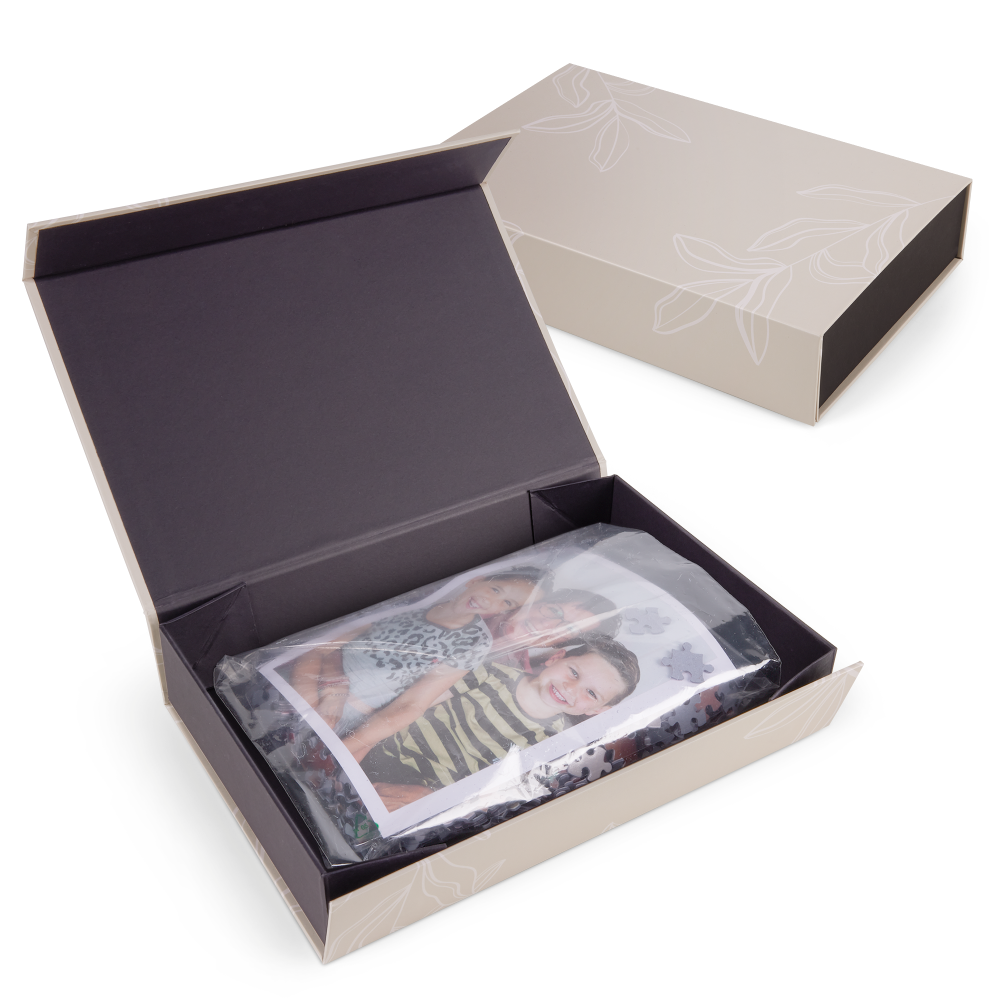 Small personalized puzzle with a photo of three smiling kids printed on it, in an open gift box.