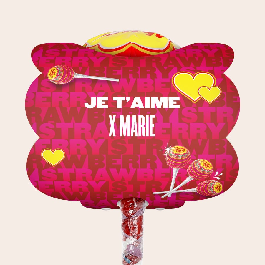 Mega Chupa Chups - personnalisé Méga Chupa Chups personnalisable fraise 20 sucettes avec message "Je t'aime x Marie" et cœurs jaunes imprimés.