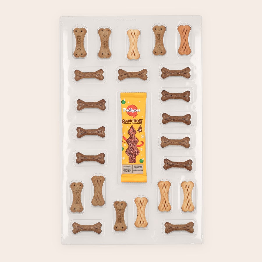 Personlig hundeadventskalender - Pedigree Gaveæske med godbidder til en hundeadventskalender med forskellige Pedigree-godbidder og en pakke Ranchos. Få deres hale til at logre hver dag.
