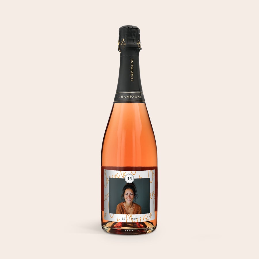 Personalised Champagne - René Schloesser - Rosé Rosé champagne bottle with a personalized label, printed with a woman's photo and the text "EST. 1989"