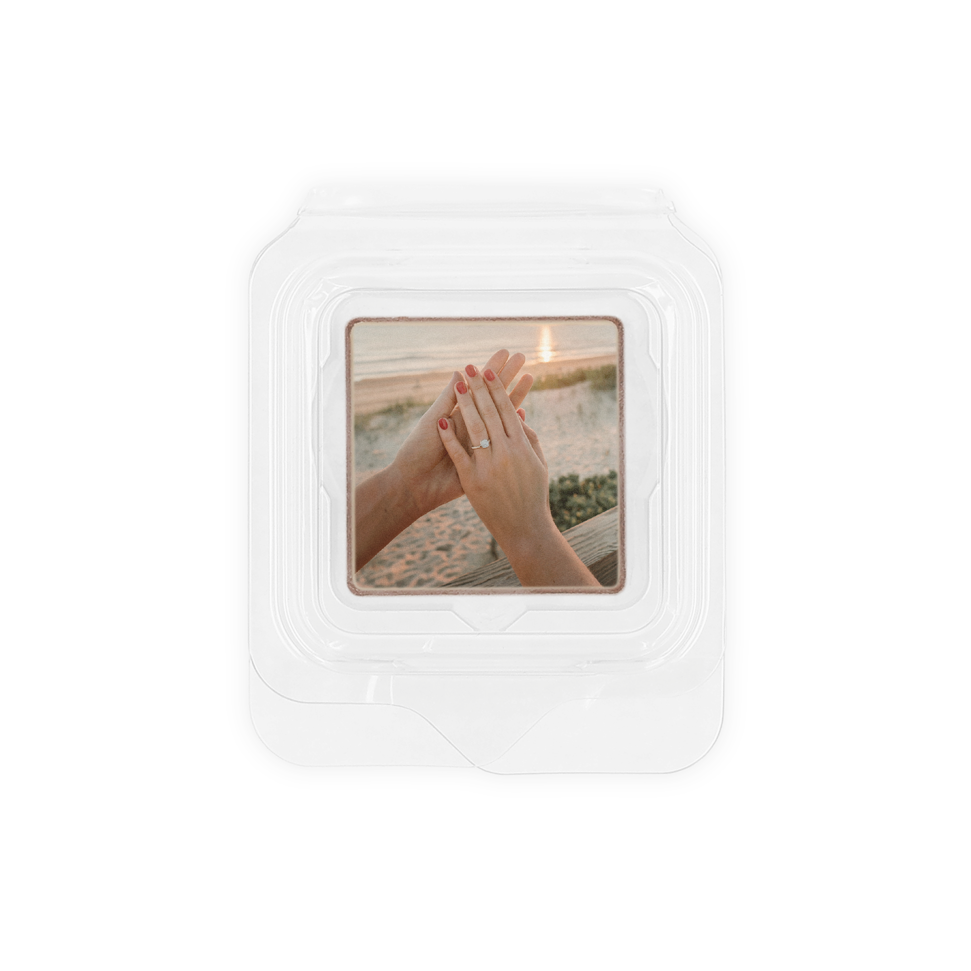 Individual personalized chocolate favour printed with an engagement photo on a beach background