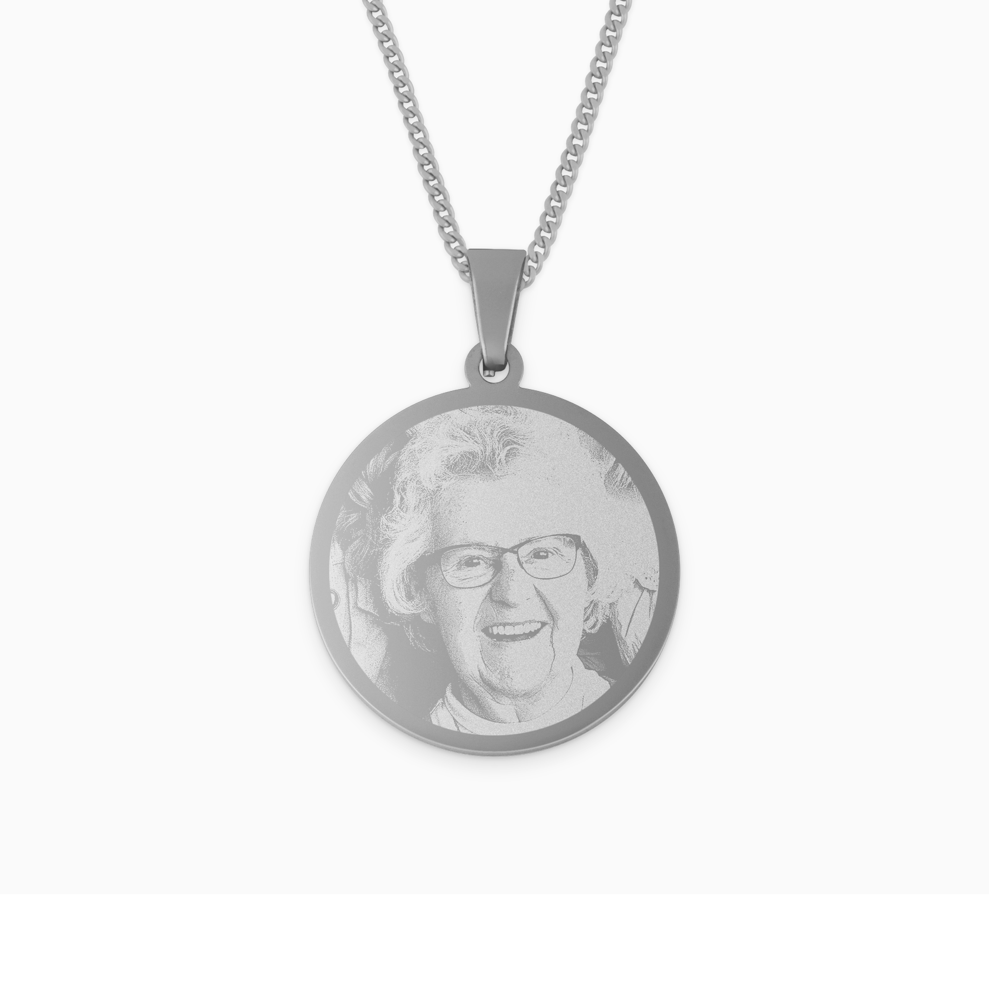 Rhodium pendant engraved with a smiling photo of a woman in glasses, attached to a silver chain.