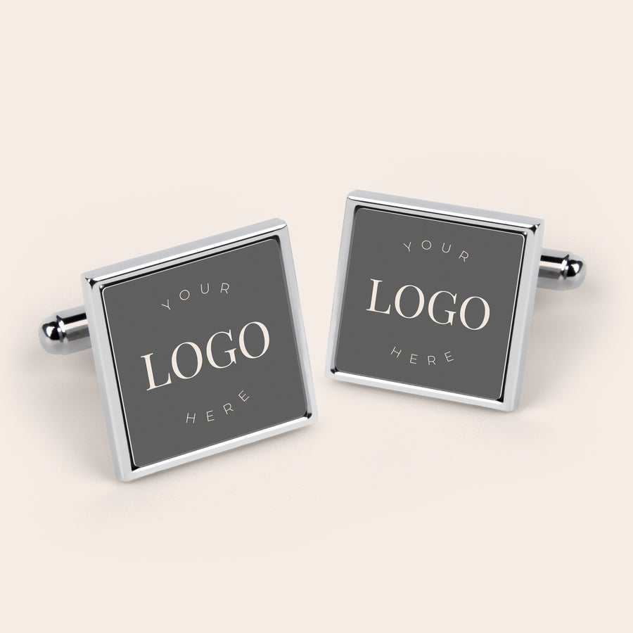 Cufflinks Two square silver cufflinks, each printed with the text YOUR LOGO HERE, customizable with your photo or logo