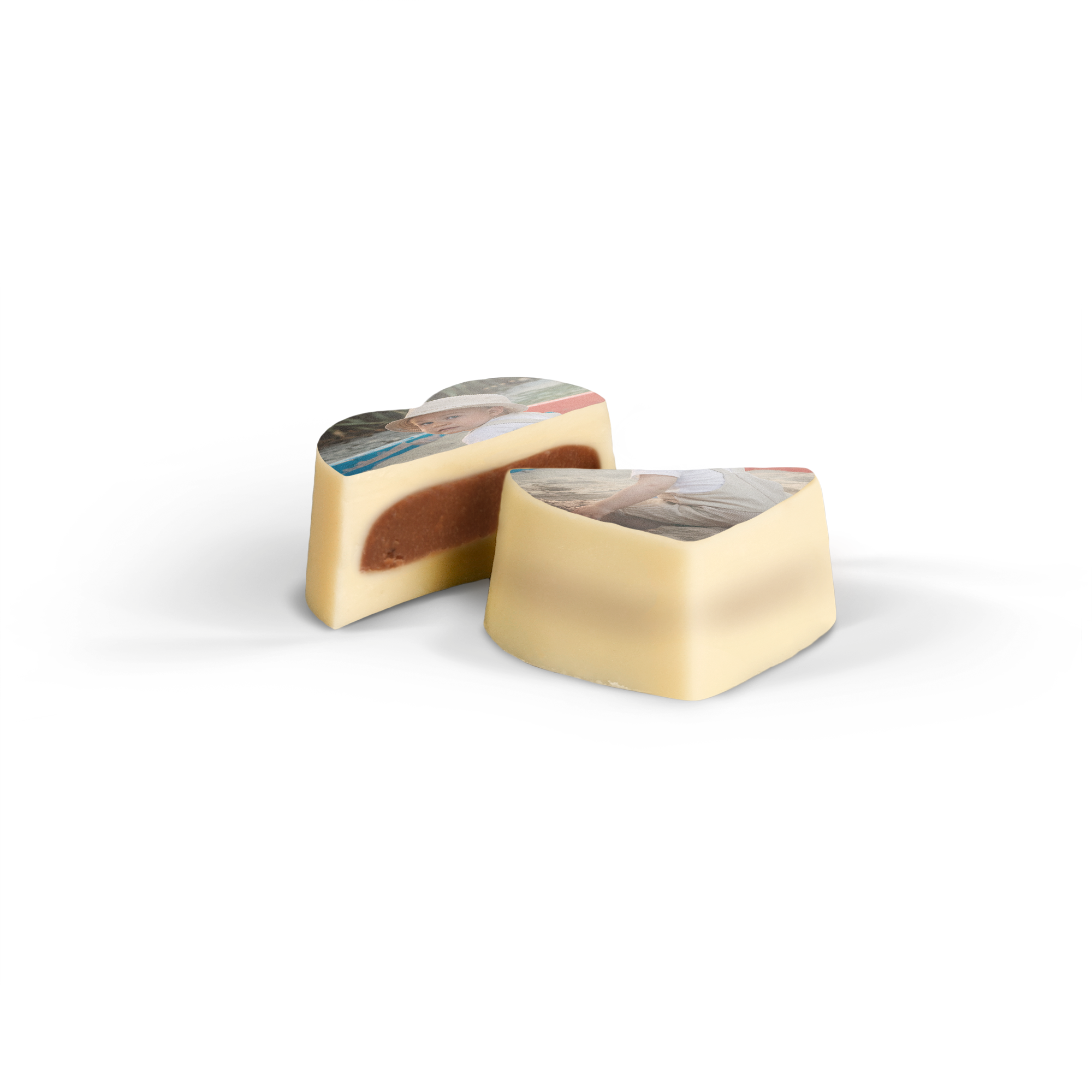 Two delicious praline favours, printed with a custom photo, one cut open to show the hazelnut filling